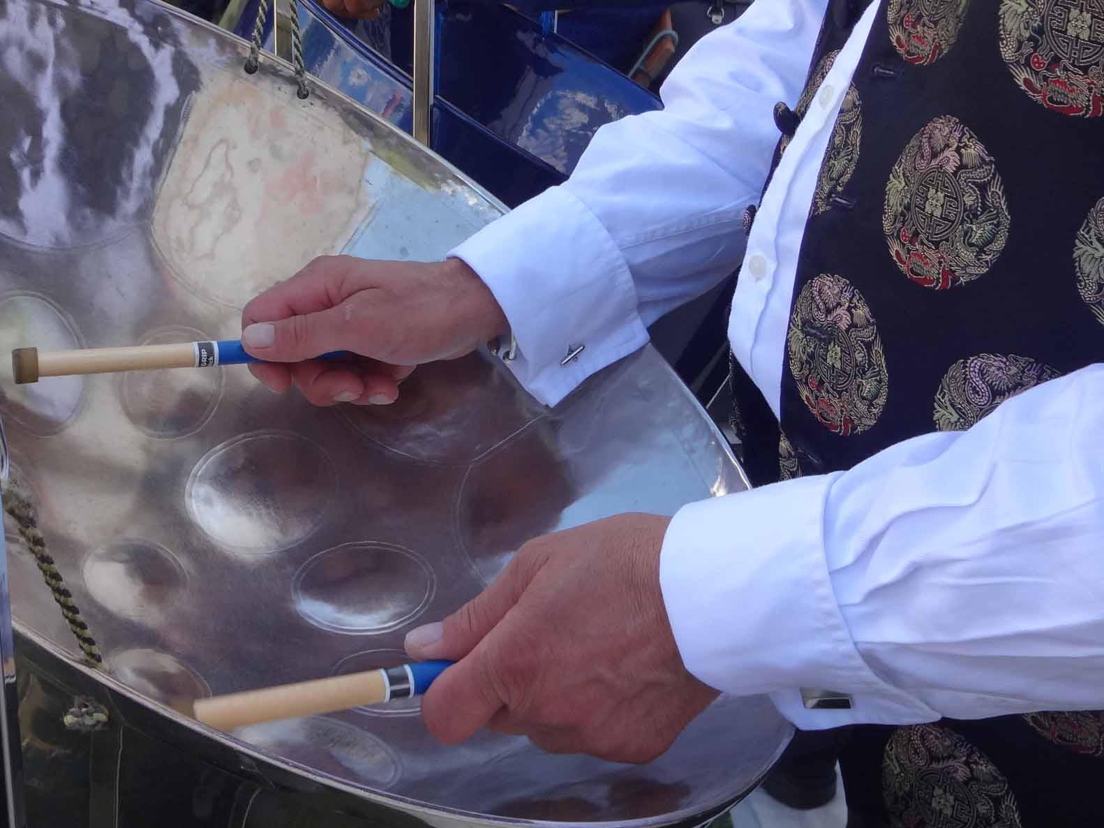 Close-up of a musician playing steel drums at a wedding, part of the best steel drum band for weddings. Inquire for bookings.