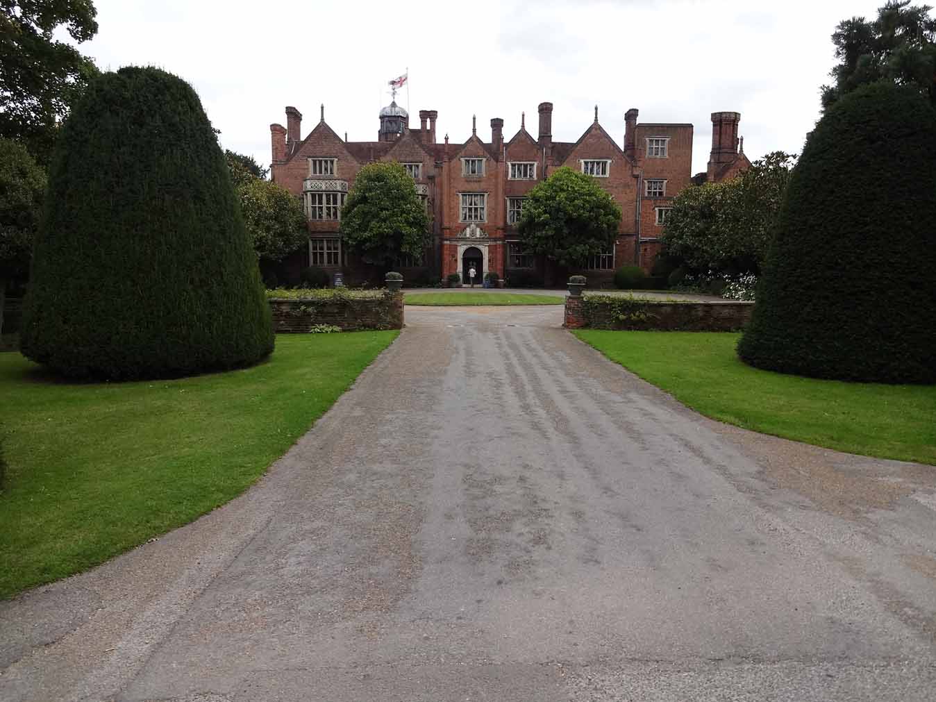 Elegant wedding venue at Great Fosters, showcasing beautifully landscaped gardens and classic architecture, perfect for luxurious weddings.